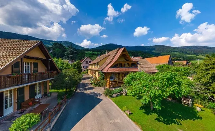 Framed Print : Old but renovated village house in countryside aerial view, Alsace, France Framed Print : Old but renovated village house in countryside aerial view, Alsace, France