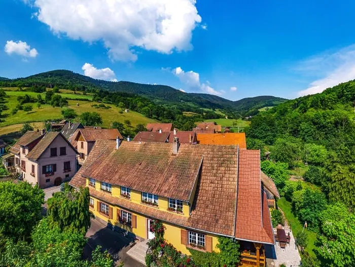 Framed Print : Old but renovated village house in countryside aerial view, Alsace, France Framed Print : Old but renovated village house in countryside aerial view, Alsace, France