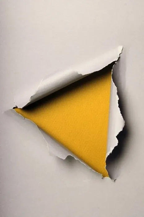 Framed Print : Old ripped paper forming triangle over yellow background Framed Print : Old ripped paper forming triangle over yellow background