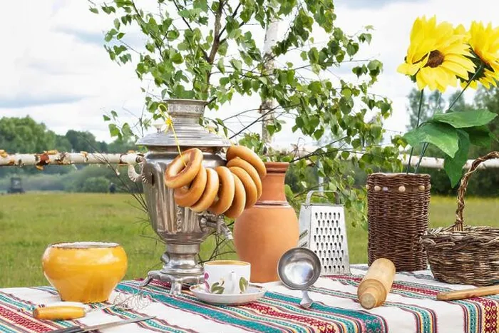 Framed Print : Old Russian rustic table with samovar, bagels and other kitchen utensils outdoors in the garden Framed Print : Old Russian rustic table with samovar, bagels and other kitchen utensils outdoors in the garden