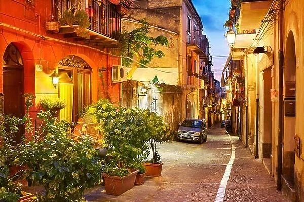 Old town street at evening lighting, Cefalu, Sicily, Italy