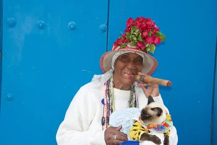 Framed Print : Old woman posing for photos with cigar and cat Old Havana Cuba Framed Print : Old woman posing for photos with cigar and cat Old Havana Cuba