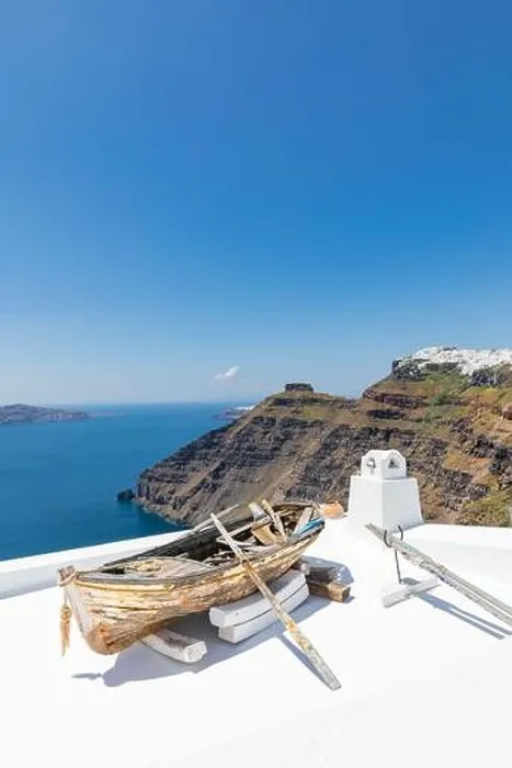 Framed Print : Old wooden boat on the white rooftops of caldera in Santorini, Greece. Amazing summer landscape, travel adventure, sea view over white architecture Framed Print : Old wooden boat on the white rooftops of caldera in Santorini, Greece. Amazing summer landscape, travel adventure, sea view over white architecture