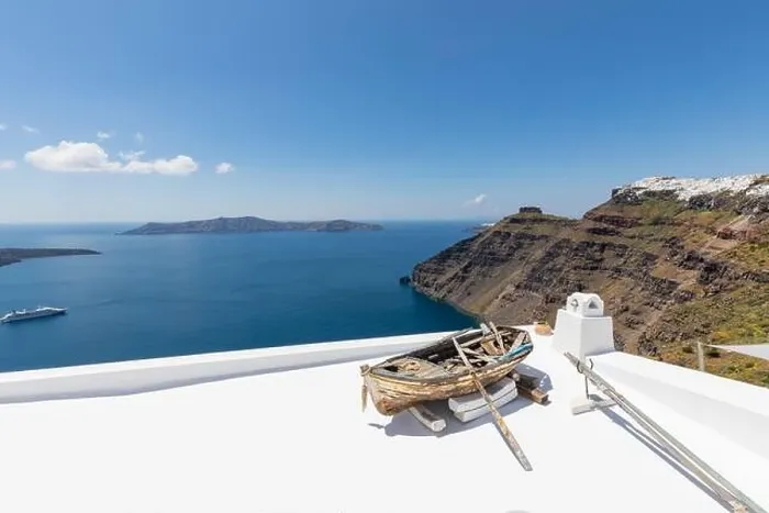 Framed Print : Old wooden boat on the white rooftops of caldera in Santorini, Greece. Amazing summer landscape, travel adventure, sea view over white architecture Framed Print : Old wooden boat on the white rooftops of caldera in Santorini, Greece. Amazing summer landscape, travel adventure, sea view over white architecture