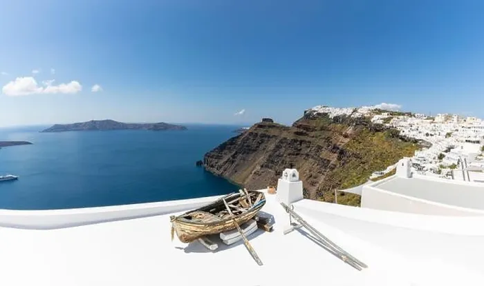 Framed Print : Old wooden boat on the white rooftops of caldera in Santorini, Greece. Amazing summer landscape, travel adventure, sea view over white architecture Framed Print : Old wooden boat on the white rooftops of caldera in Santorini, Greece. Amazing summer landscape, travel adventure, sea view over white architecture