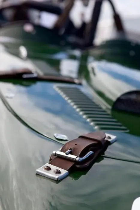 Framed Print : Old worn leather classic car bonnet straps