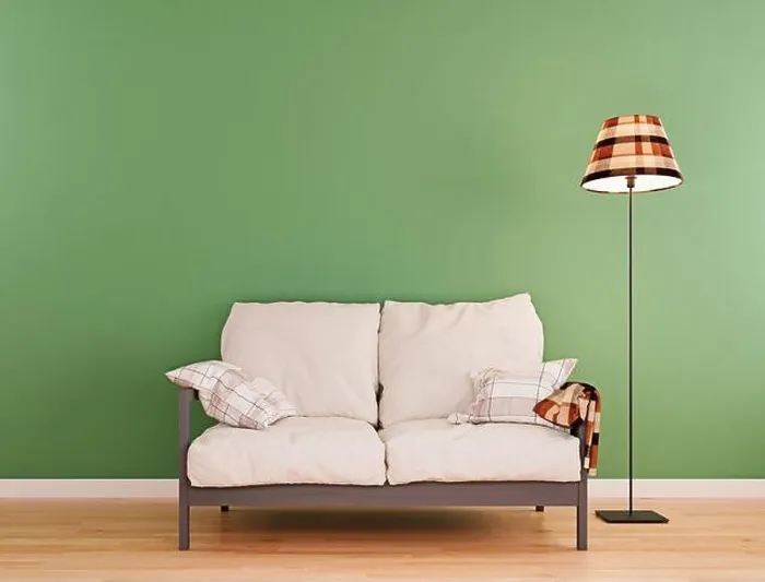 Framed Print : Olive green mock-up wall with small white sofa and floor lamp in modern interior background Framed Print : Olive green mock-up wall with small white sofa and floor lamp in modern interior background