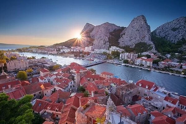 Omis, Croatia. Cityscape image of beautiful coastal town Omis, Dalmatia, Croatia at summer sunset