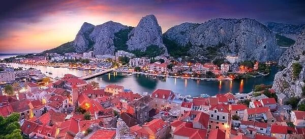 Omis, Croatia. Panoramic cityscape image of beautiful coastal town Omis, Dalmatia, Croatia at summer sunset