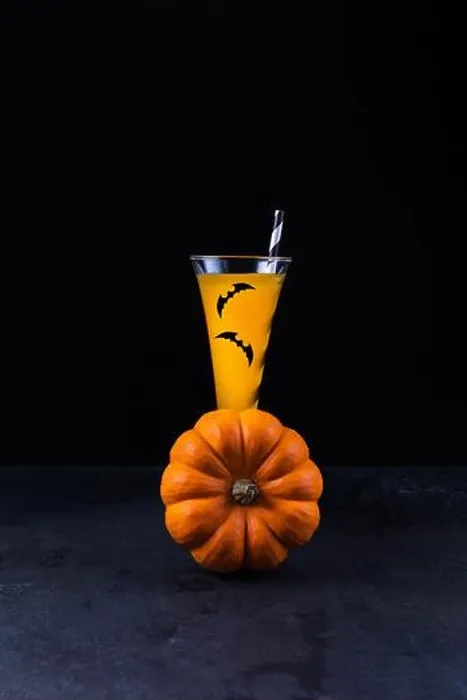 Framed Print : Orange pumpkin and pumpkin non-alcoholic mocktail in tall glass decorated with paper bats Framed Print : Orange pumpkin and pumpkin non-alcoholic mocktail in tall glass decorated with paper bats