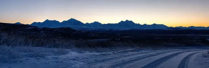 Framed Print : Orange sky behind mountain range after sunset on a snowy roadvnear Delta Junction, Alaska Framed Print : Orange sky behind mountain range after sunset on a snowy roadvnear Delta Junction, Alaska