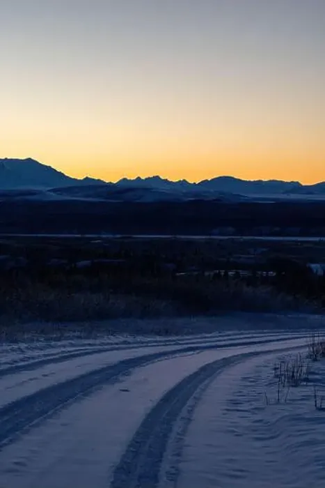 Framed Print : Orange sky behind mountains after sunset on a snowy roadvnear Delta Junction, Alaska Framed Print : Orange sky behind mountains after sunset on a snowy roadvnear Delta Junction, Alaska