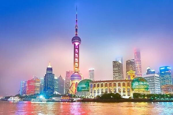 Oriental Pearl and Financial district skyline on the Huangpu River, Shanghai, China