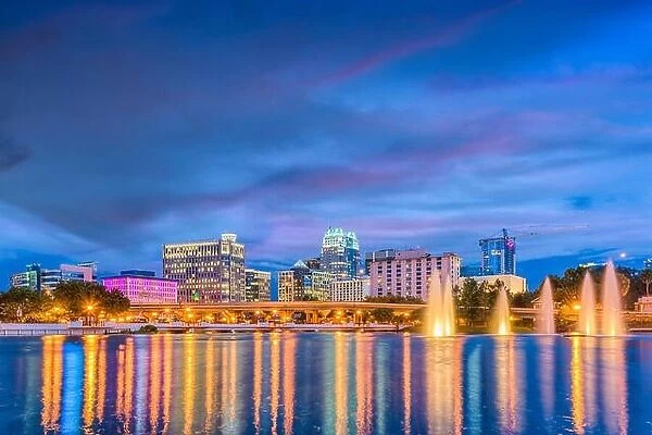 Orlando, Florida, USA skyline on the lake at dusk