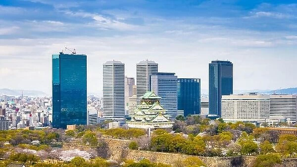 Osaka, Japan at skyline and castle in springtime from above