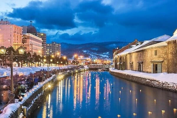 Otaru, Japan winter skyline on the canals during the twilight light up