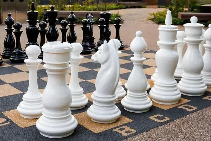 Framed Print : Outdoor chess board with big plastic pieces Framed Print : Outdoor chess board with big plastic pieces