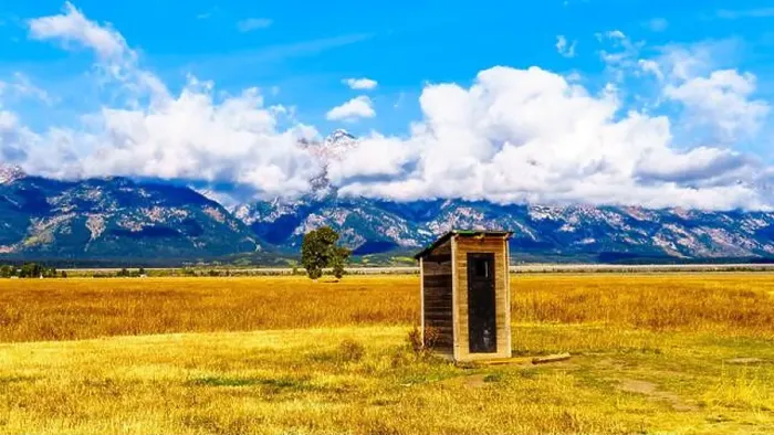 Framed Print : An Outhouse at Mormon Row with in the background cloud covered Peaks of the Grand Tetons In Grand Tetons National Park Framed Print : An Outhouse at Mormon Row with in the background cloud covered Peaks of the Grand Tetons In Grand Tetons National Park