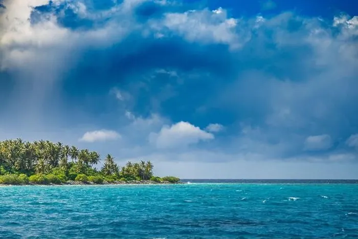 Framed Print : Overcast tropical beach with white sand, palm trees, turquoise ocean against cloudy sky with waves on sunny summer day. Perfect landscape background Framed Print : Overcast tropical beach with white sand, palm trees, turquoise ocean against cloudy sky with waves on sunny summer day. Perfect landscape background