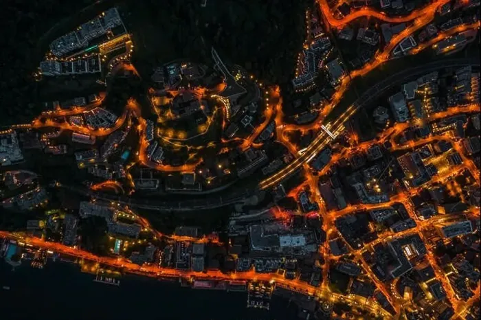 Framed Print : Overhead aerial drone night shot of city street lights in Lugano, Switzerland Framed Print : Overhead aerial drone night shot of city street lights in Lugano, Switzerland