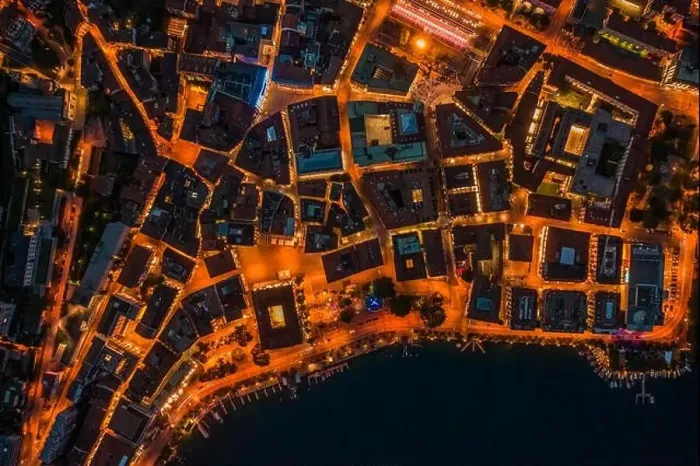 Framed Print : Overhead aerial drone night shot of city street lights in Lugano, Switzerland Framed Print : Overhead aerial drone night shot of city street lights in Lugano, Switzerland