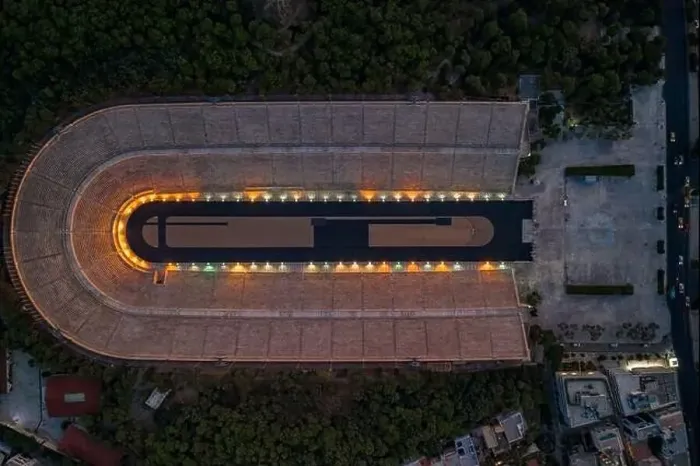 Framed Print : Overhead aerial drone shot of Panathenaic marble stadium with lights in dusk Pangrati, Athens Framed Print : Overhead aerial drone shot of Panathenaic marble stadium with lights in dusk Pangrati, Athens