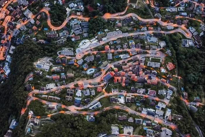 Framed Print : Overhead aerial drone shot view of winding mountain road street light on Monte Bre in Lugano, Switzerland Framed Print : Overhead aerial drone shot view of winding mountain road street light on Monte Bre in Lugano, Switzerland