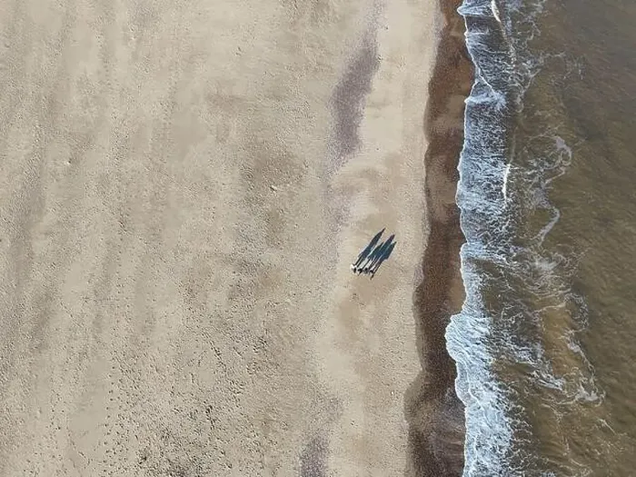 Framed Print : Overhead birds eye drone aerial view people walking on beach long shadows Great Yarmouth beach Framed Print : Overhead birds eye drone aerial view people walking on beach long shadows Great Yarmouth beach
