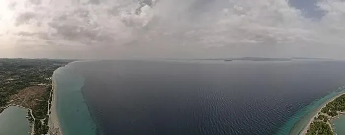 Framed Print : Overhead drone photo over the tropical blue ocean and the bay of Glarokavos in Paliouri, Halkidiki, Greece Framed Print : Overhead drone photo over the tropical blue ocean and the bay of Glarokavos in Paliouri, Halkidiki, Greece