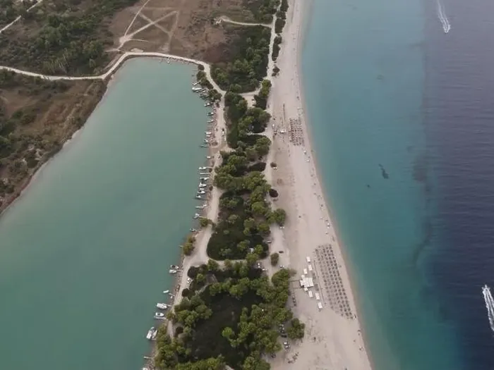 Framed Print : Overhead drone photo over the tropical blue ocean and the bay of Glarokavos in Paliouri, Halkidiki, Greece Framed Print : Overhead drone photo over the tropical blue ocean and the bay of Glarokavos in Paliouri, Halkidiki, Greece