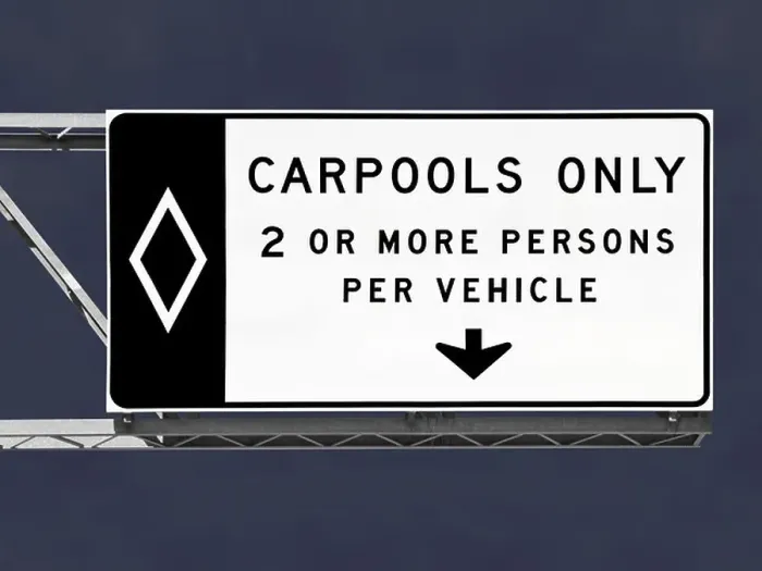 Framed Print : Overhead freeway carpool only sign with storm sky Framed Print : Overhead freeway carpool only sign with storm sky