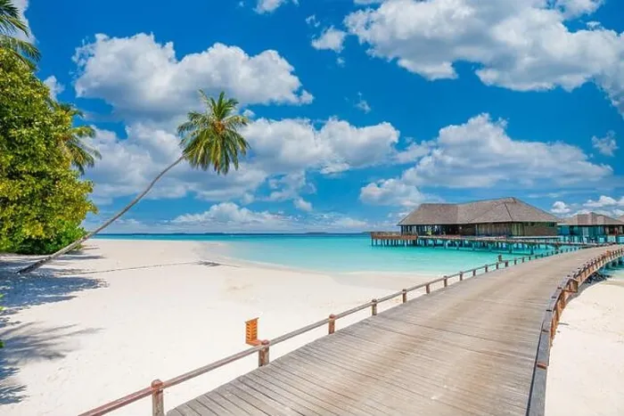 Framed Print : Overwater bungalow in the Indian Ocean. Pier palm trees white sand villas with amazing green lagoon scenic beach view. Picturesque travel landscape Framed Print : Overwater bungalow in the Indian Ocean. Pier palm trees white sand villas with amazing green lagoon scenic beach view. Picturesque travel landscape