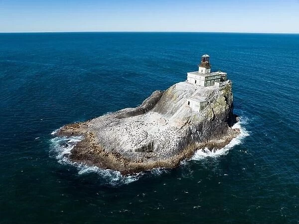 The Pacific Ocean surrounds the deactivated Tillamook Rock Lighthouse off the scenic Oregon coast. The historic lighthouse was built in 1880