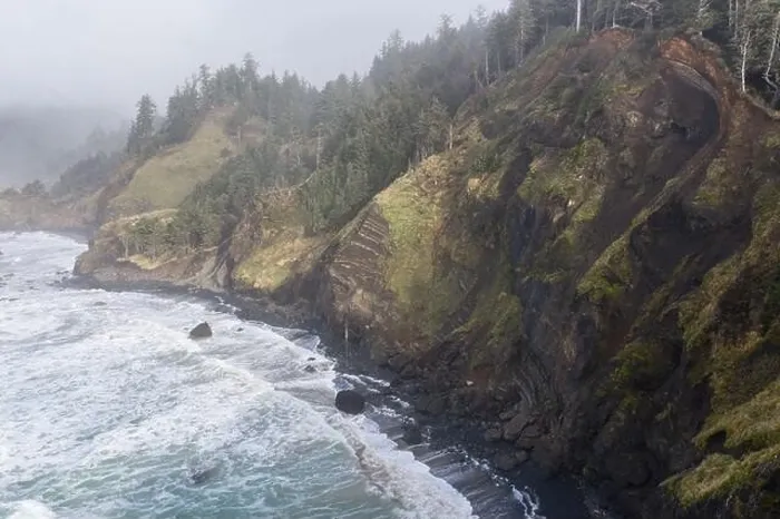 Framed Print : The Pacific Ocean washes against the rocky coastline of northern Oregon. This wild region, just west of Portland, is often covered by a dark clouds Framed Print : The Pacific Ocean washes against the rocky coastline of northern Oregon. This wild region, just west of Portland, is often covered by a dark clouds