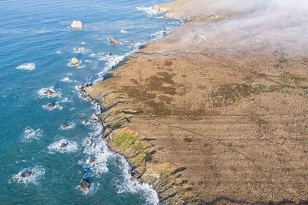The Pacific Ocean washes against the scenic coastline of northern California in Sonoma. This region is often covered by a thick marine layer of mist