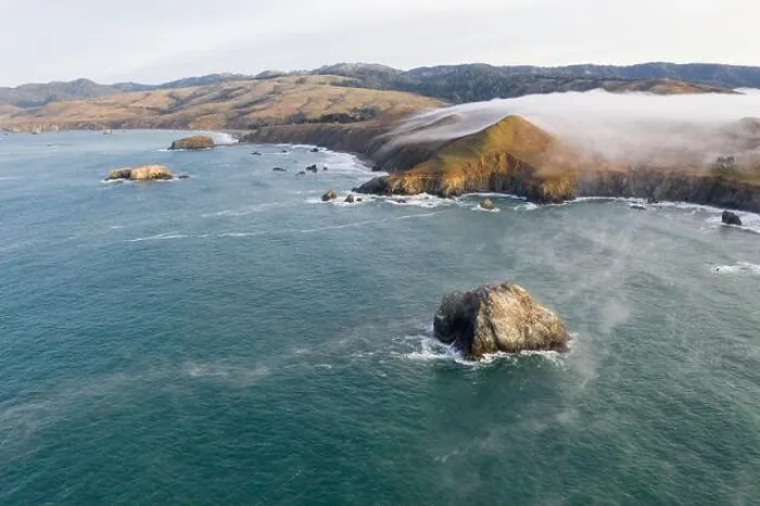 Framed Print : The Pacific Ocean washes against the scenic coastline of northern California in Sonoma. This region is often covered by a thick marine layer of mist Framed Print : The Pacific Ocean washes against the scenic coastline of northern California in Sonoma. This region is often covered by a thick marine layer of mist