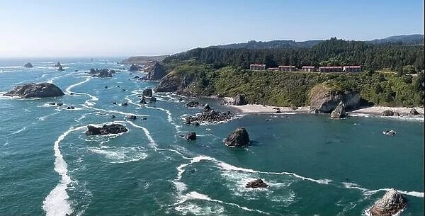 The Pacific Ocean washes against the scenic, rugged coastline of southern Oregon. This part of the Pacific Northwest is accessible via highway 101