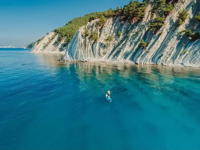 Framed Print : Paddle boarding in Mediterranean sea with mountain coastline. Aerial view Framed Print : Paddle boarding in Mediterranean sea with mountain coastline. Aerial view
