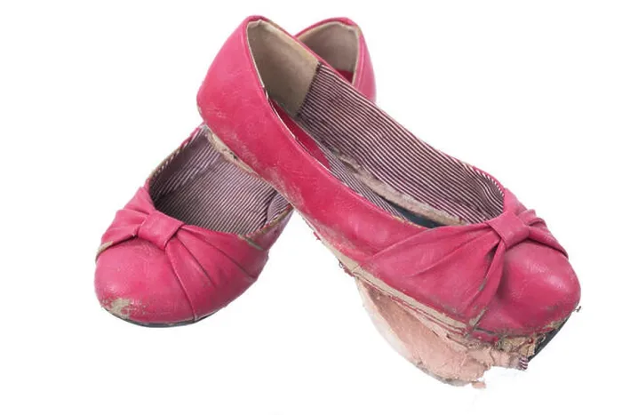Framed Print : A pair of old, dirty and worn out red women's flats isolated on a white background Framed Print : A pair of old, dirty and worn out red women's flats isolated on a white background