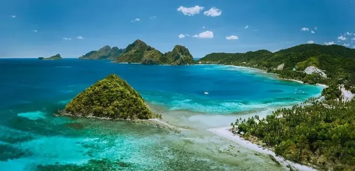 Framed Print : Palawan, Philippines. Las Cabanas beach with rocky mountains and village El Nido in background Framed Print : Palawan, Philippines. Las Cabanas beach with rocky mountains and village El Nido in background