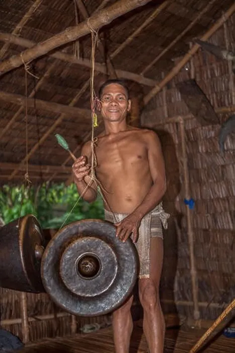 Framed Print : A Palaw'ano man plays a Philippine Agung gong with a beater (betay) at the tribal village in Puerto Princesa, Palawan, Philippines Framed Print : A Palaw'ano man plays a Philippine Agung gong with a beater (betay) at the tribal village in Puerto Princesa, Palawan, Philippines