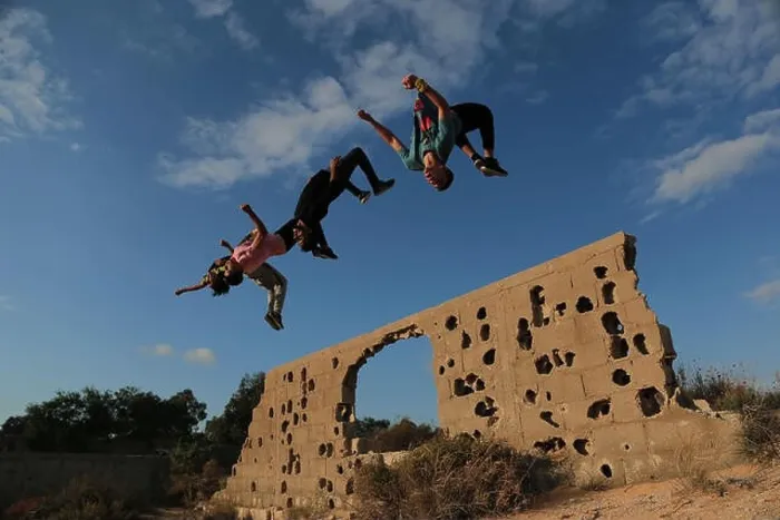Framed Print : Palestinian youth are seen jumping in the same style during their Parkour practice at the war-torn stones Framed Print : Palestinian youth are seen jumping in the same style during their Parkour practice at the war-torn stones