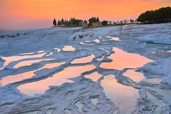 Pamukkale limestone terraces at sunset time, Pamukkale, Turkey