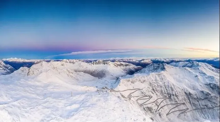 Framed Print : Pano by drone of sunrise over the narrow bends of Stelvio Pass mountain road covered with snow Framed Print : Pano by drone of sunrise over the narrow bends of Stelvio Pass mountain road covered with snow