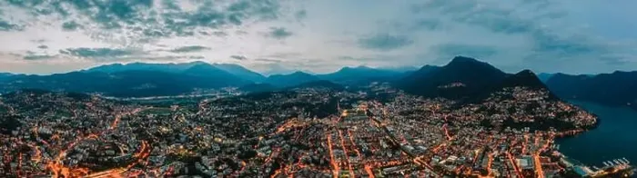 Framed Print : Panorama aerial drone night shot of city street lights by lake in Lugano, Switzerland Framed Print : Panorama aerial drone night shot of city street lights by lake in Lugano, Switzerland