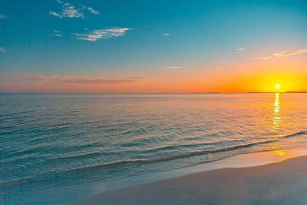Panorama of beautiful sunset on the ocean. Idyllic beach nature