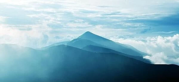 Panorama of beauty blue foggy mountains range. Landscape photography