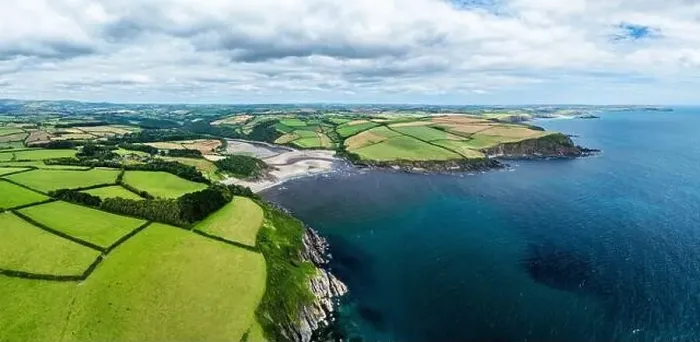 Framed Print : Panorama of Cliffs over Mothecombe Beach and Red Cove from a drone Framed Print : Panorama of Cliffs over Mothecombe Beach and Red Cove from a drone