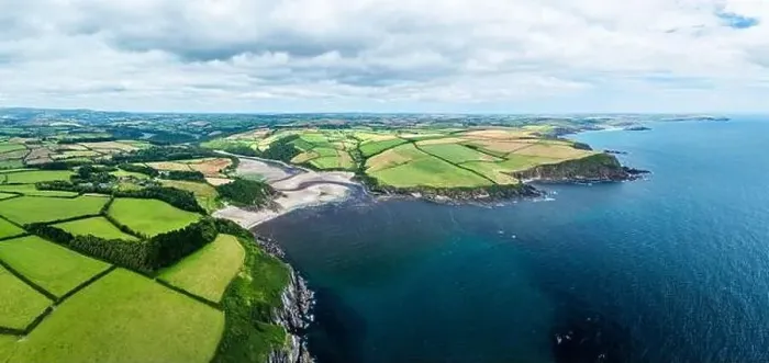 Framed Print : Panorama of Cliffs over Mothecombe Beach and Red Cove from a drone Framed Print : Panorama of Cliffs over Mothecombe Beach and Red Cove from a drone