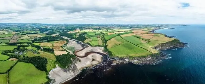 Framed Print : Panorama of Cliffs over Mothecombe Beach and Red Cove from a drone Framed Print : Panorama of Cliffs over Mothecombe Beach and Red Cove from a drone